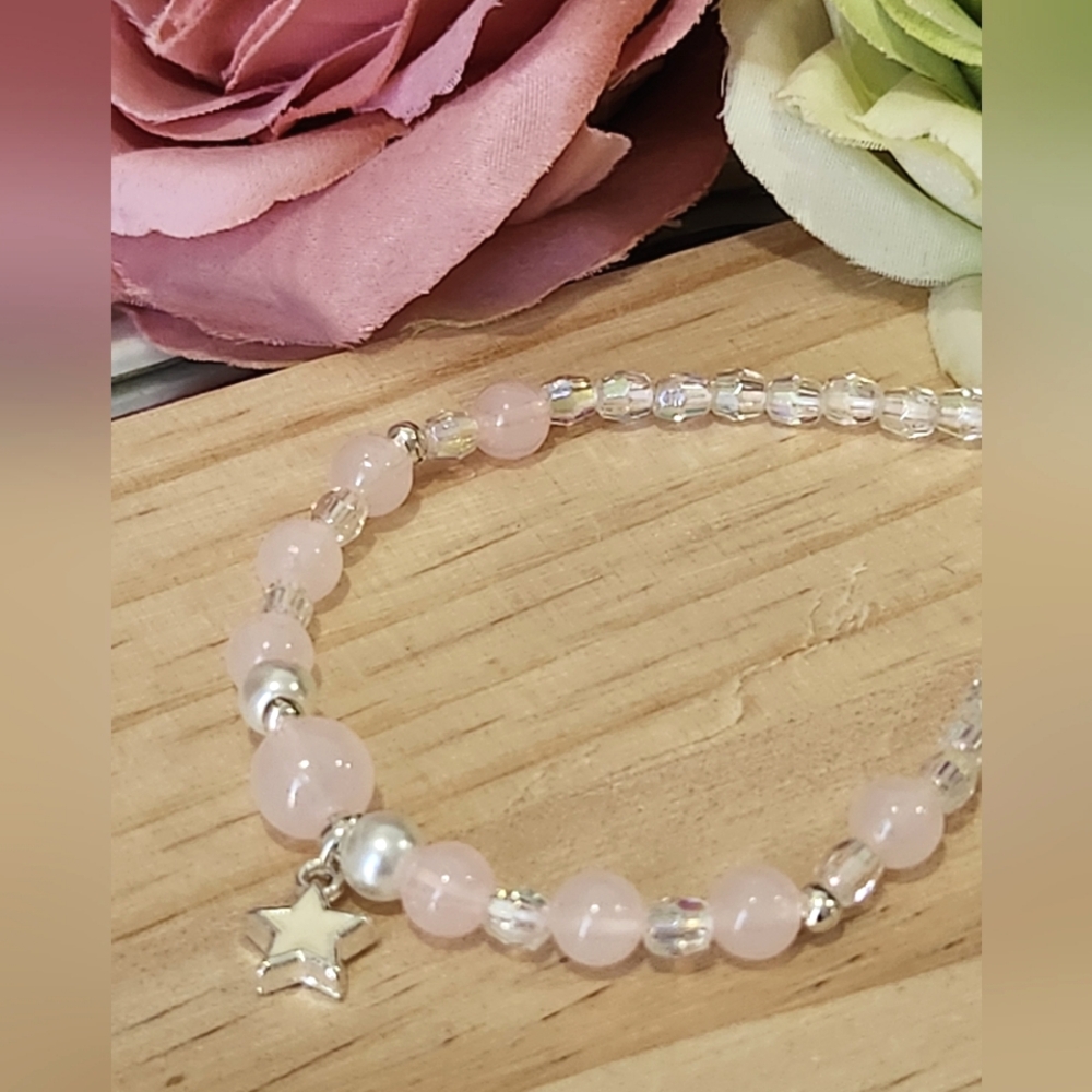 Bracelet with pink glass beads and star pendent